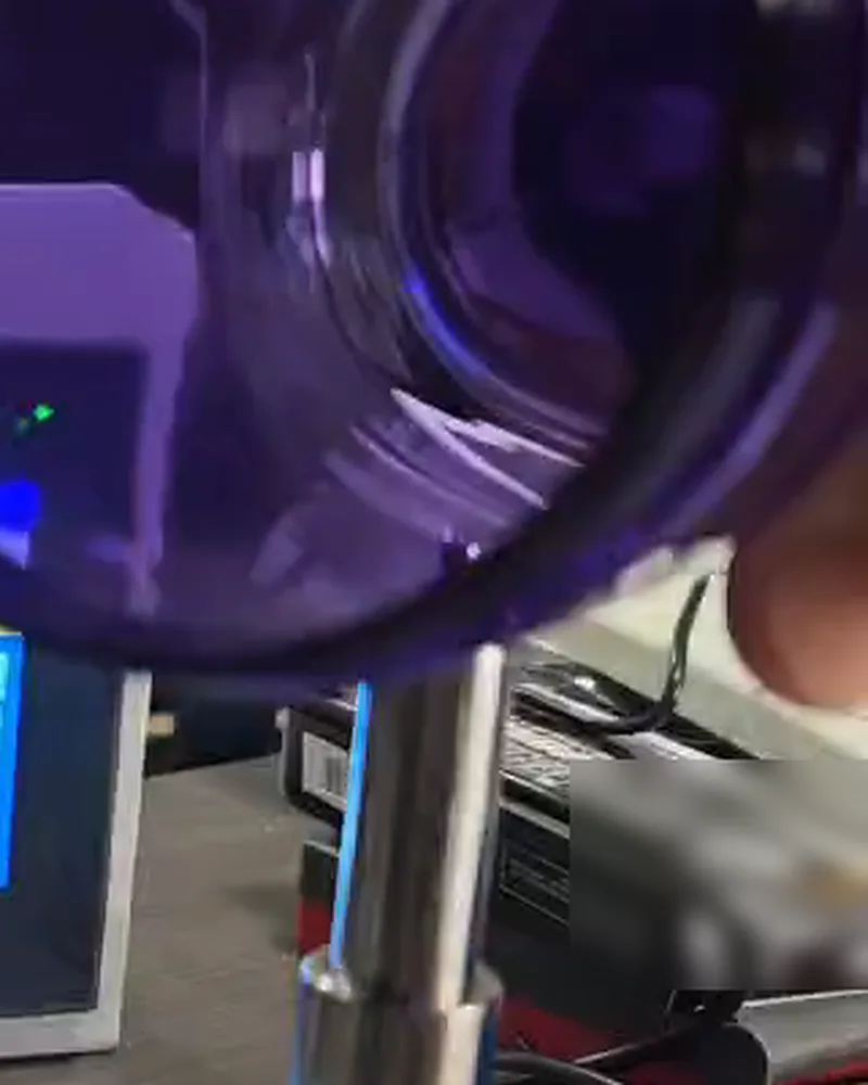 Side wall of a plastic bottle being moved across the probe tip